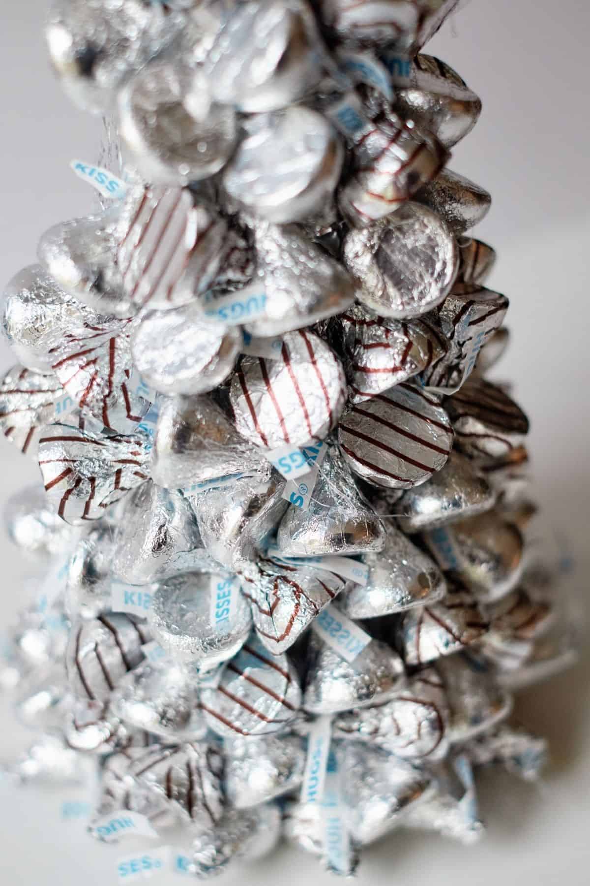 Close up of the kisses Christmas tree on a grey background.